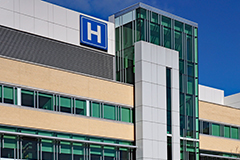 building with large H sign for hospital